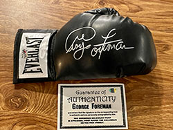 George Foreman Autographed Black Everlast Boxing Glove (JSA COA)